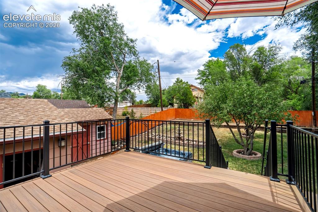 Image 20 of 50: Expansive composite deck featuring black metal railings