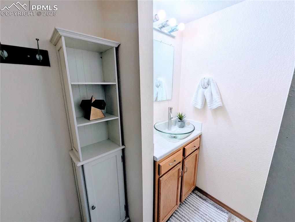 Image 12 of 19: Bathroom with vanity