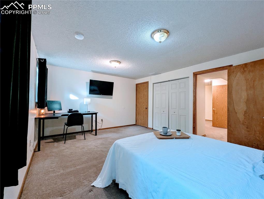 Image 15 of 19: Bedroom with a closet, and additional storage