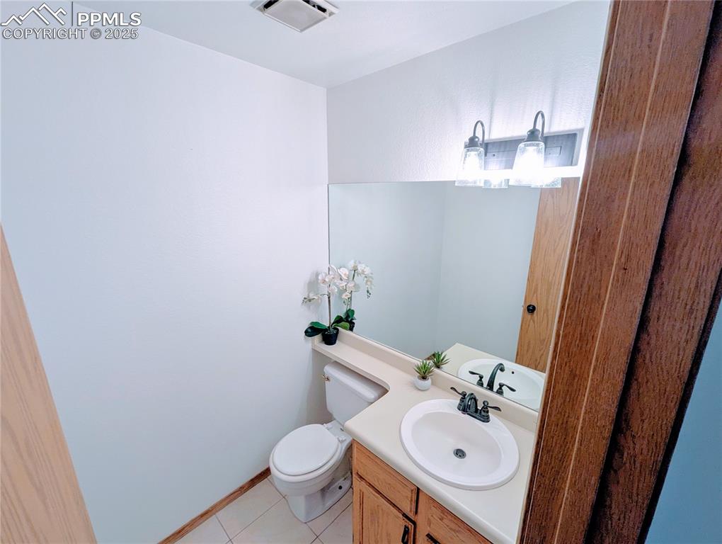 Image 2 of 19: Bathroom featuring vanity and light tile patterned flooring