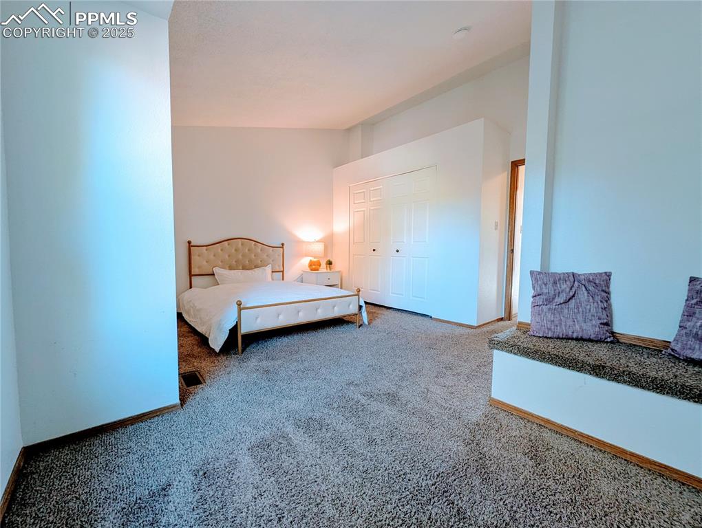 Image 9 of 19: Bedroom with carpet floors and a closet