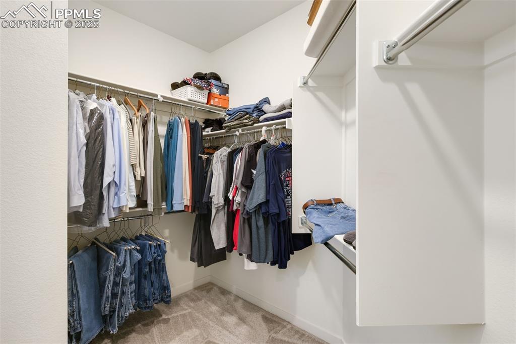 Image 22 of 36: Primary closet 