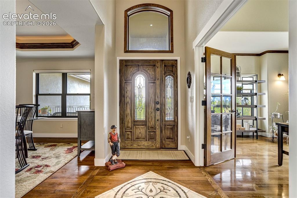 Image 11 of 46: formal dining to left, office to right