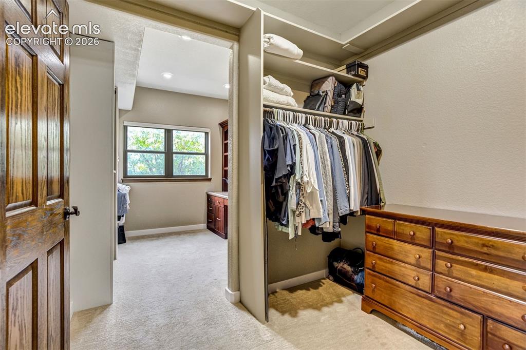 Image 18 of 46: primary walk in closet