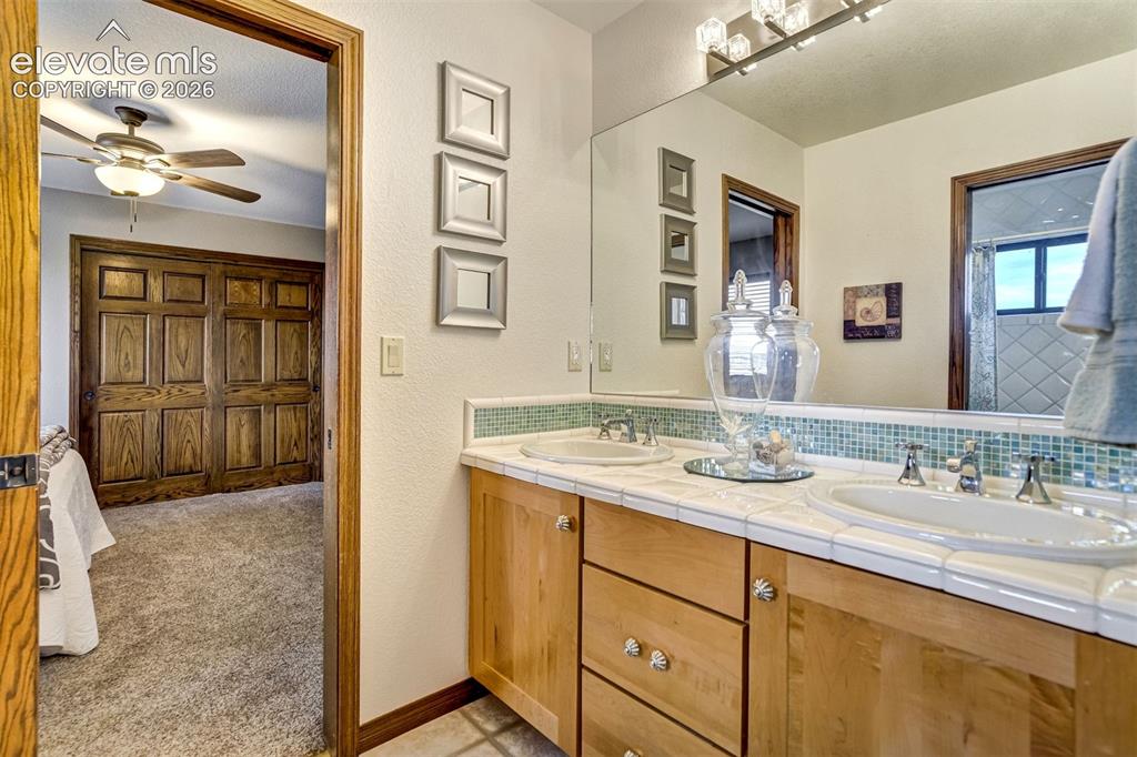 Image 24 of 46: jack & jill bathroom between bedroom 3 & 4