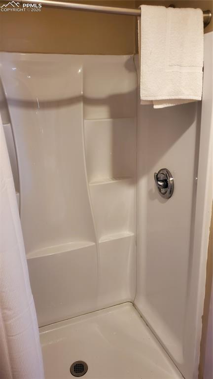 Image 24 of 36: Full bath featuring a stall shower