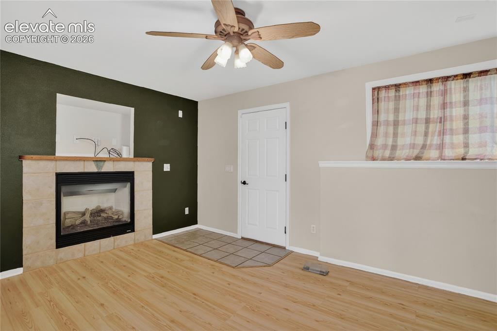 Image 10 of 20: Family room w/ fireplace - lower level