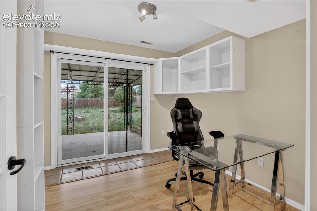 Image 11 of 20: Office w/ walk-out to patio - lower level