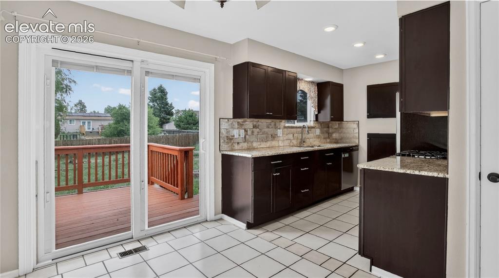 Image 4 of 20: Walk-out from dining area to deck