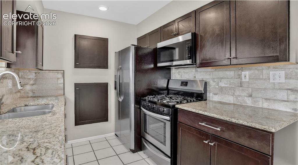 Image 5 of 20: SS appliance including gas stovetop