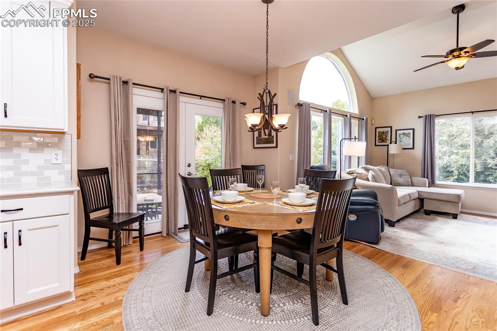 Image 19 of 47: Dining room featuring lofted ceiling, healthy amount of natural light, ligh