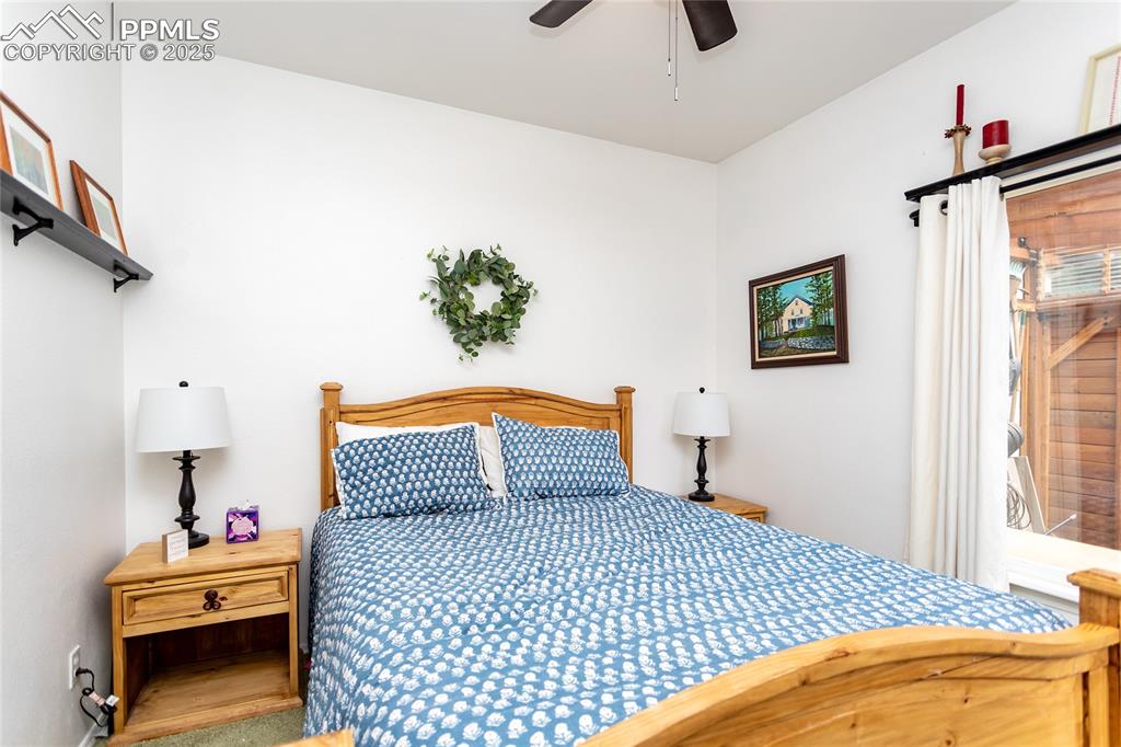 Image 25 of 47: Bedroom with ceiling fan