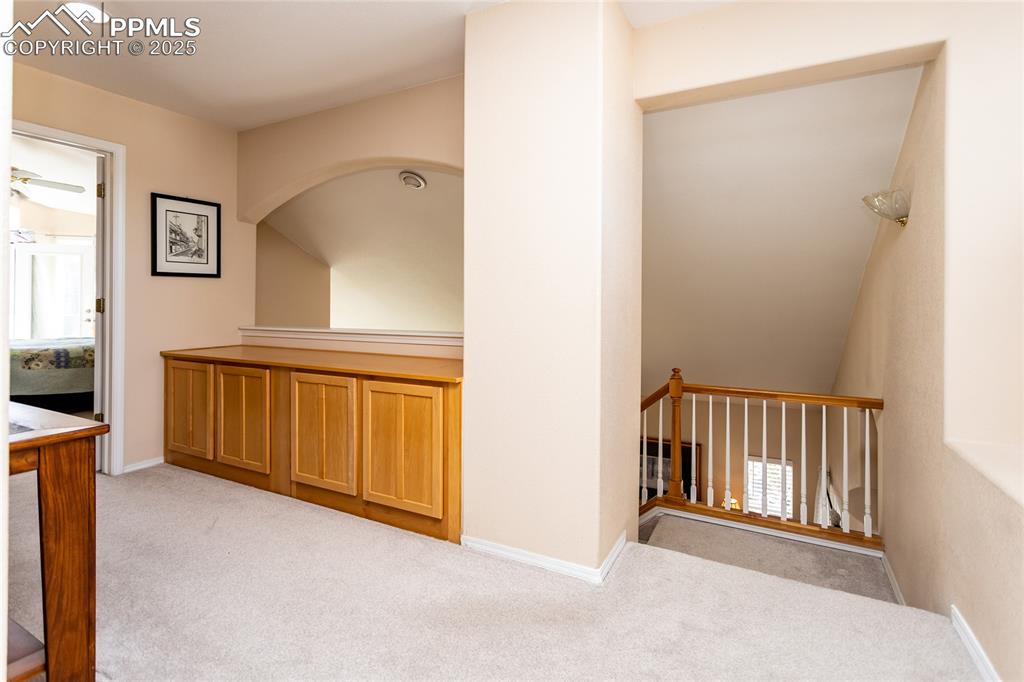 Image 26 of 47: Hallway with light carpet