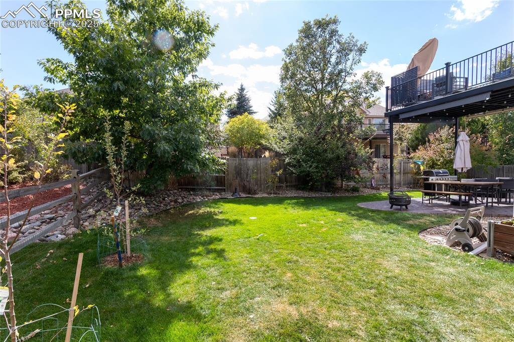 Image 45 of 47: Fenced backyard featuring a patio and a deck