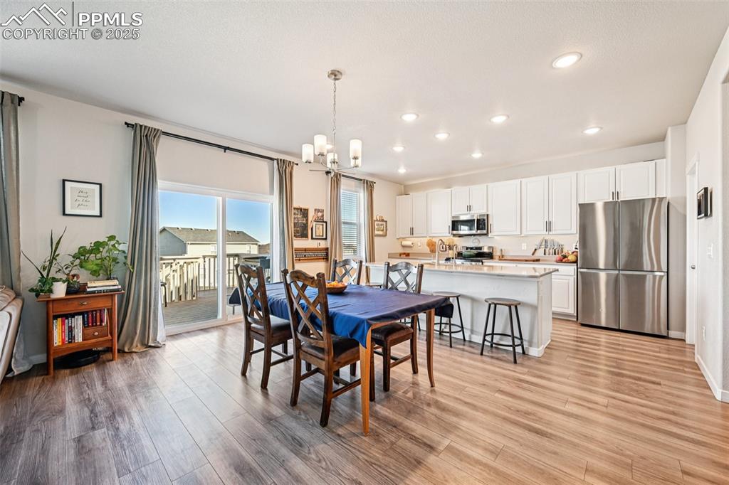 Image 13 of 50: Dining room with walk out to deck