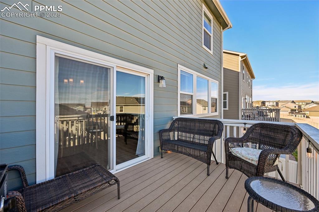 Image 14 of 50: Walk out deck off dining room