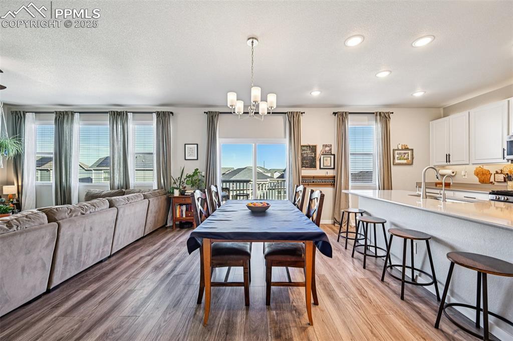 Image 16 of 50: Dining room with walk out to deck