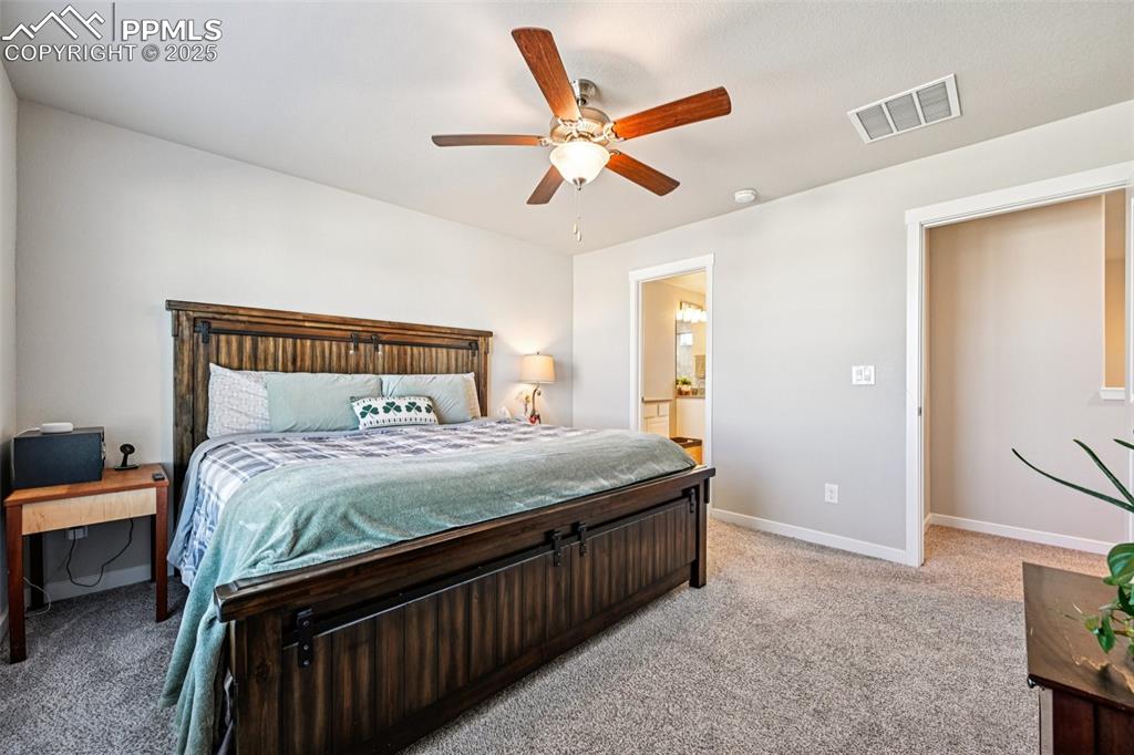 Image 26 of 50: Primary bedroom with en suite bathroom