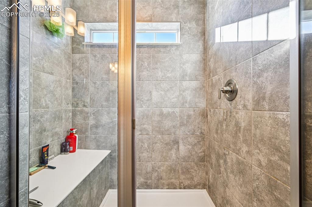 Image 30 of 50: Custom stand in shower in the primary bathroom