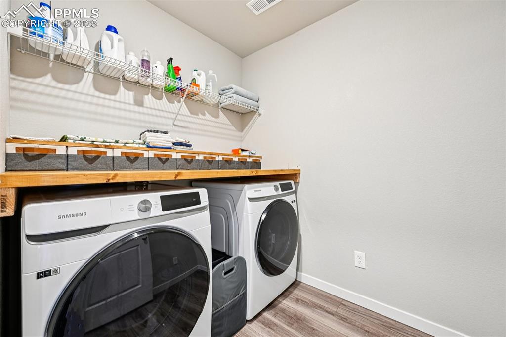 Image 35 of 50: Laundry conveniently located on the upper level