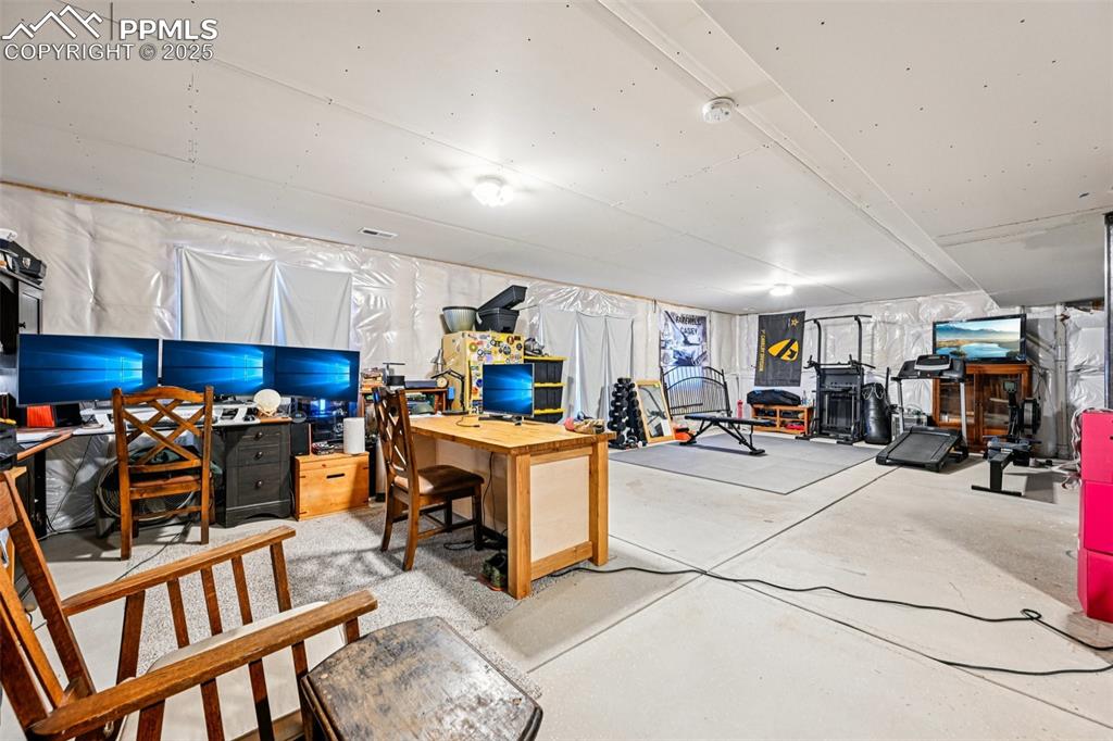 Image 41 of 50: Unfinished basement with a walk out