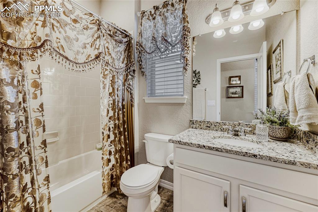 Image 23 of 30: Full bath with shower / tub combo, and vanity