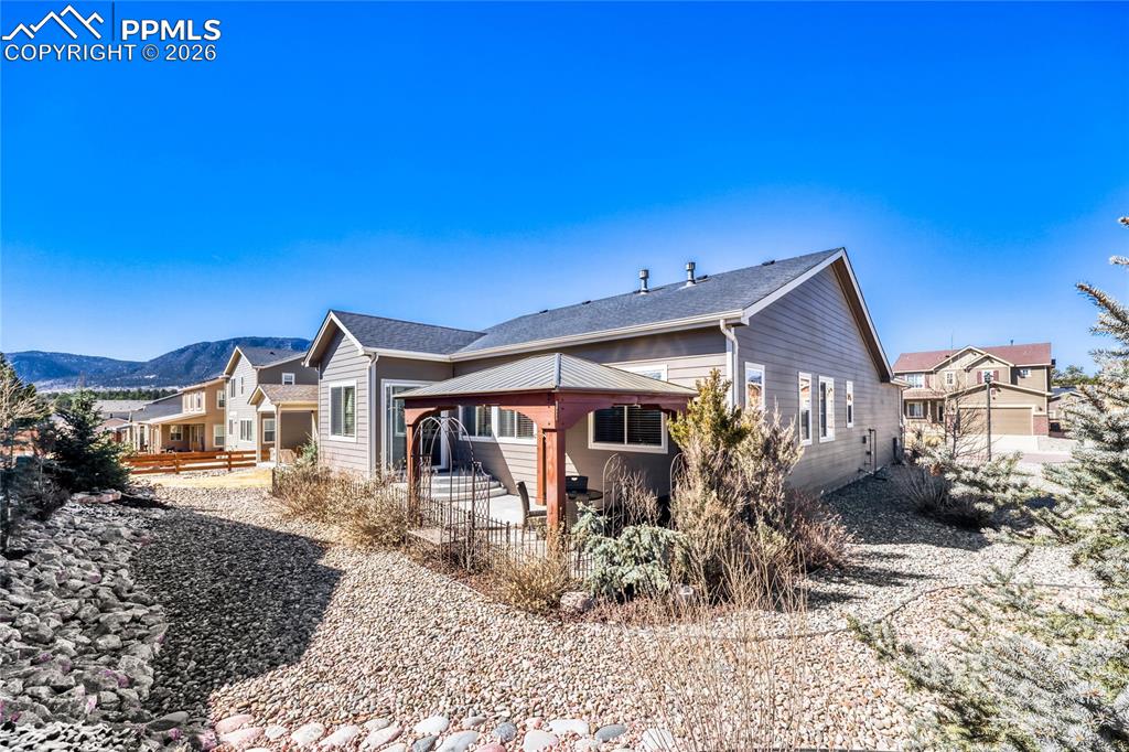 Image 25 of 30: Rear view of property featuring a patio area