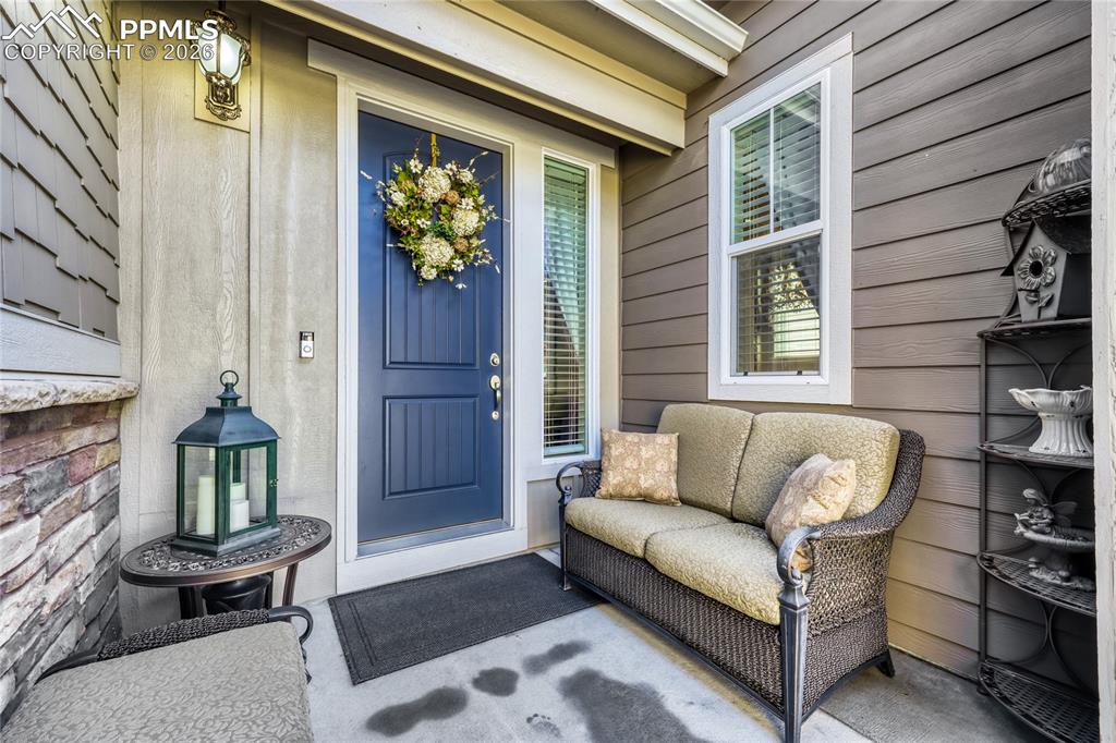 Image 4 of 30: View of spacious exterior entry with charming gate. 