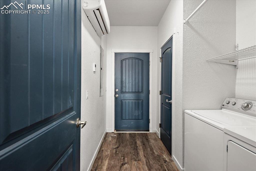 Image 29 of 33: Laundry area featuring laundry area, dark wood-type flooring, baseboards, w