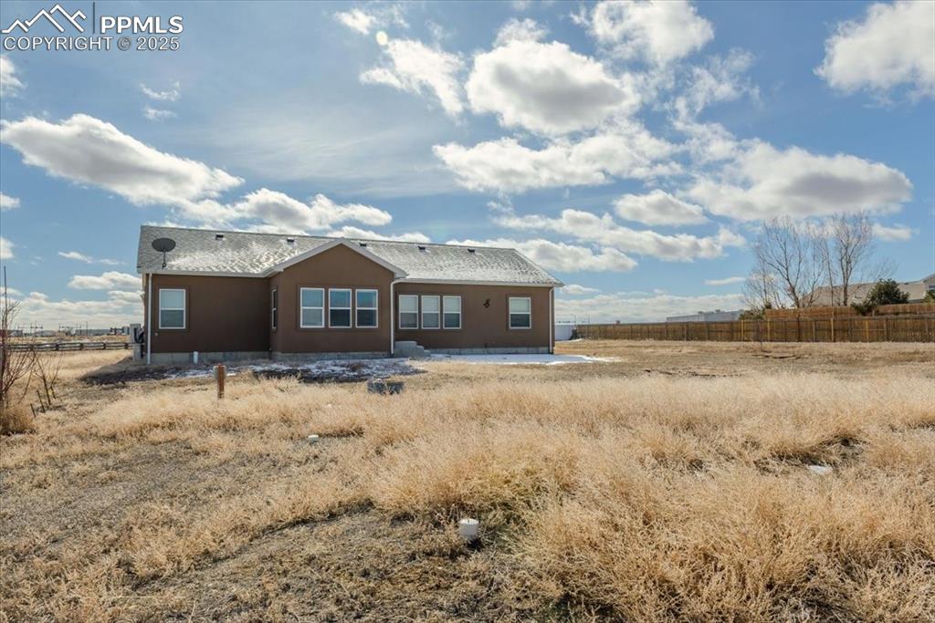 Image 33 of 33: Back of property featuring a rural view and fence