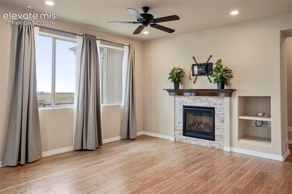 Image 12 of 48: Upgraded wood laminate flooring through much of the main level