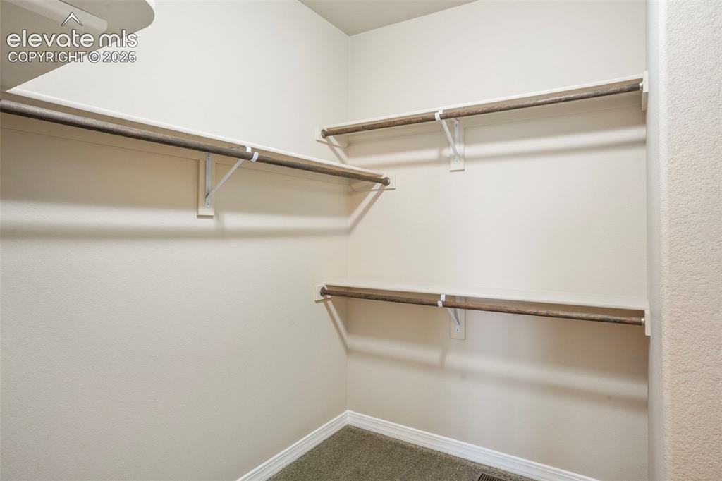 Image 17 of 48: Master Bedroom walk-in closet