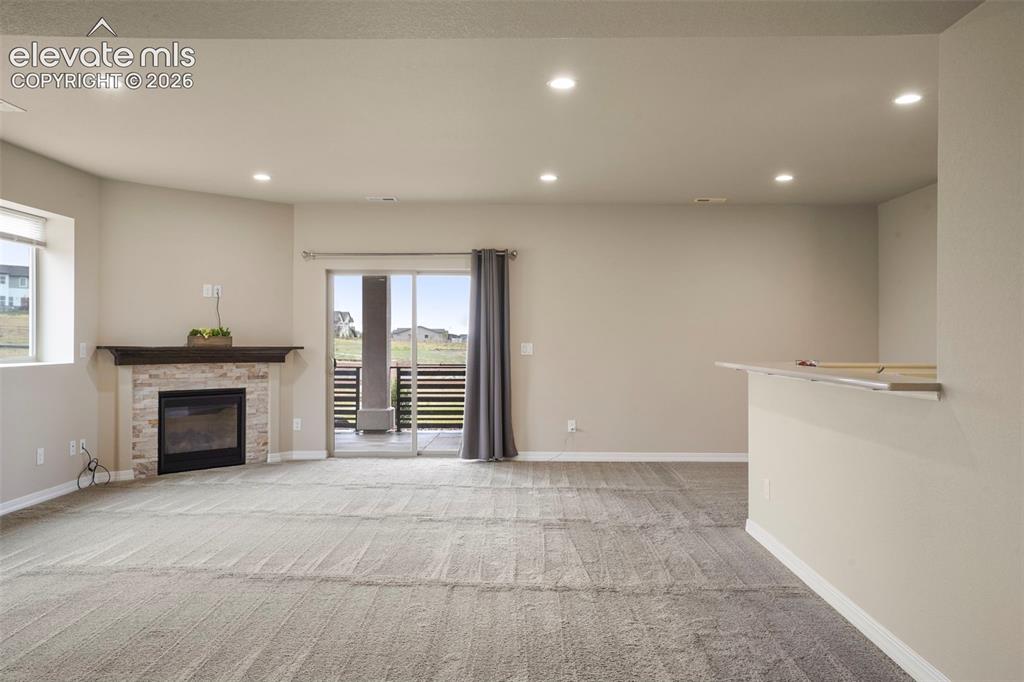 Image 23 of 48: Walkout from Family Room to patio and views of open space