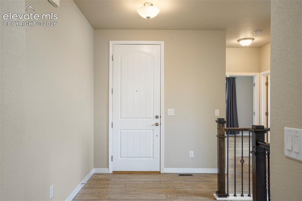 Image 30 of 48: Front Entry with Coat Closet