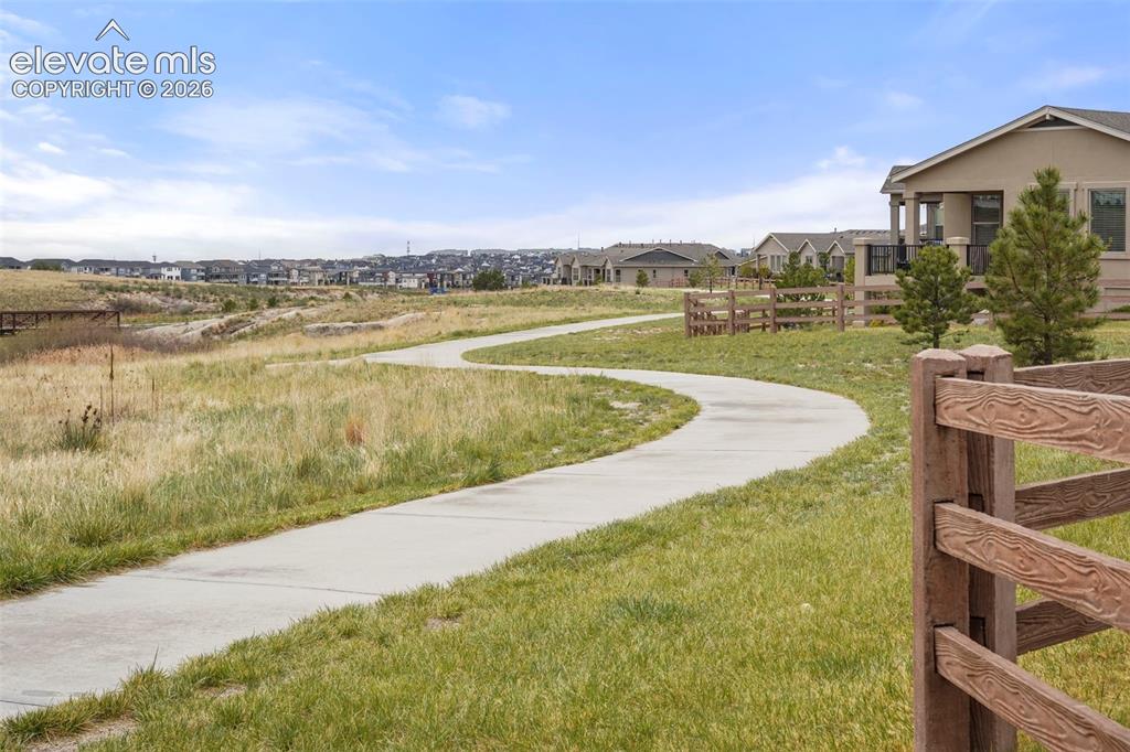 Image 36 of 48: Neighborhood Trail behind the home