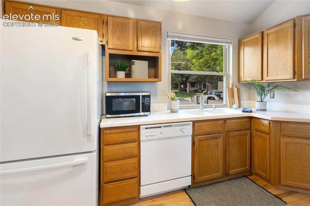 Image 19 of 34: Cute kitchen with a window out front