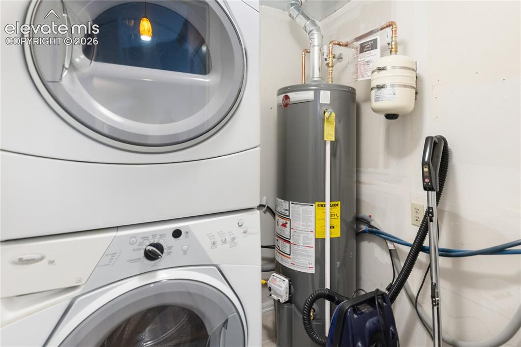 Image 30 of 34: Laundry and brand new hot water heater