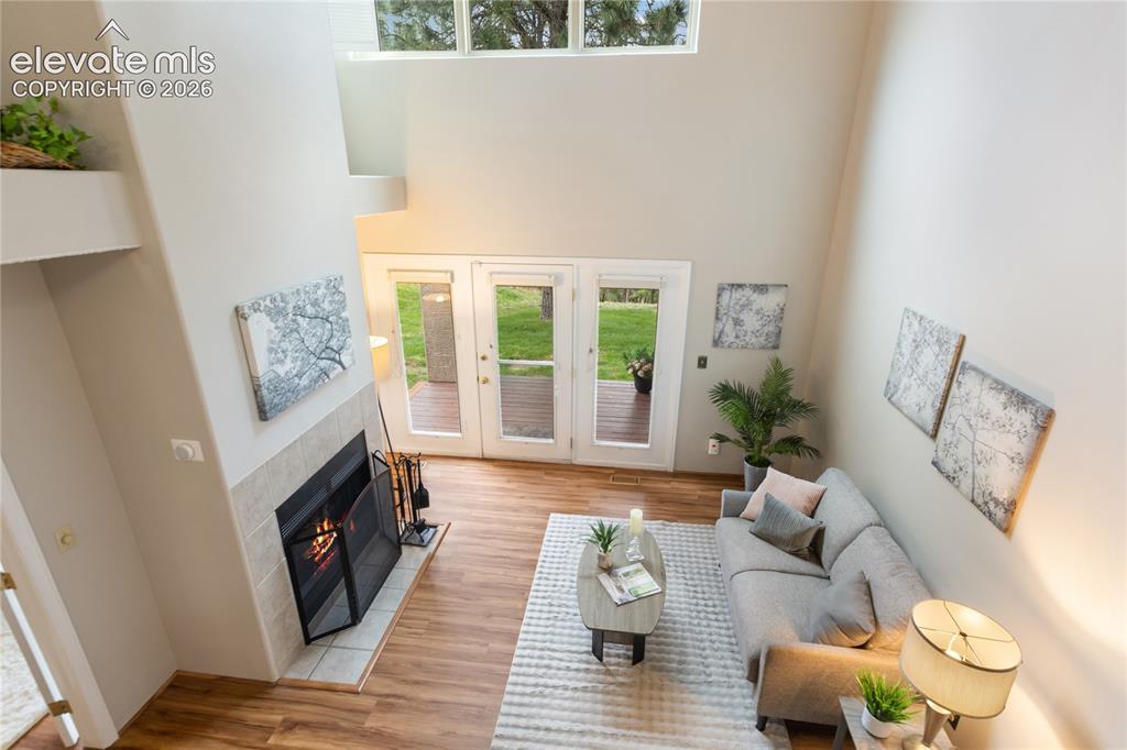 Image 6 of 34: Vaulted ceilings and a modern living room 