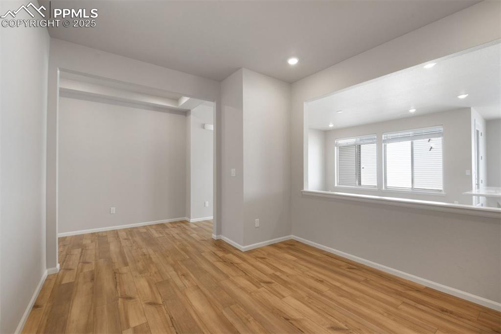 Image 14 of 33: Spare room with light wood-style floors and recessed lighting