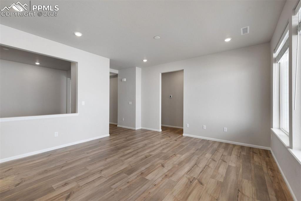 Image 15 of 33: Unfurnished room with recessed lighting and light wood finished floors