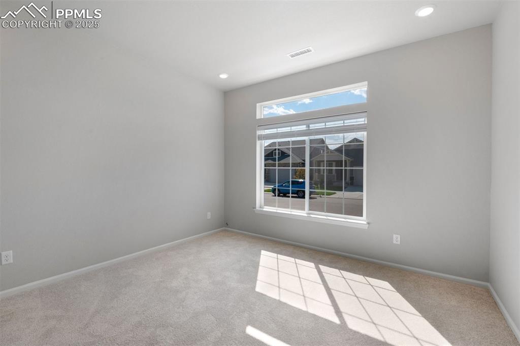 Image 32 of 33: Spare room with light carpet and recessed lighting