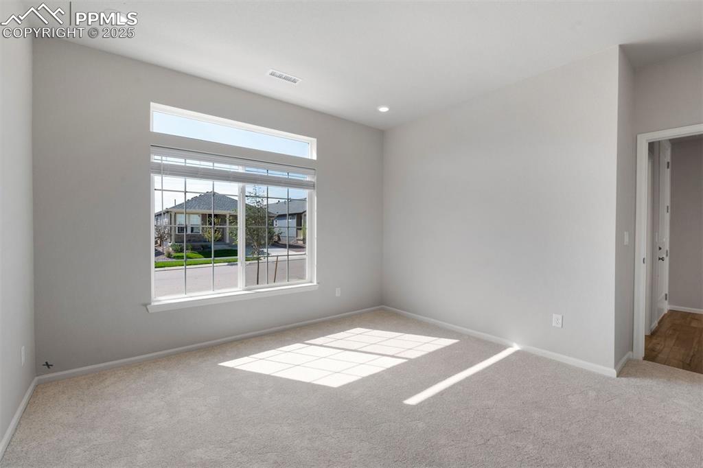 Image 33 of 33: Carpeted empty room featuring baseboards and recessed lighting