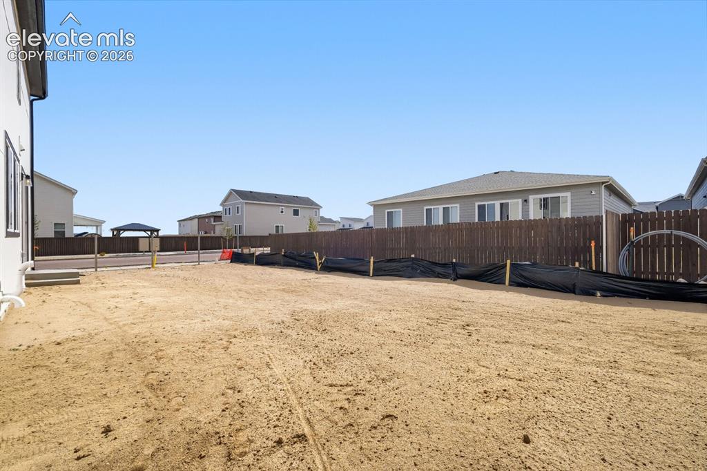 Image 27 of 31: Backyard - full fencing in progress