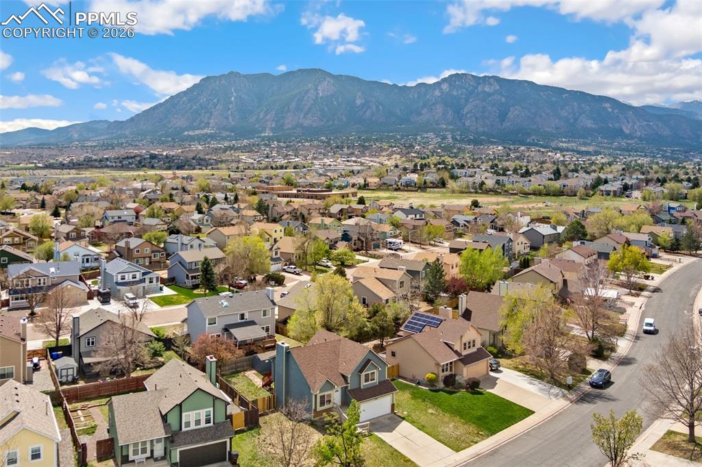 Image 35 of 35: Aerial view of residential area with a mountain backdrop