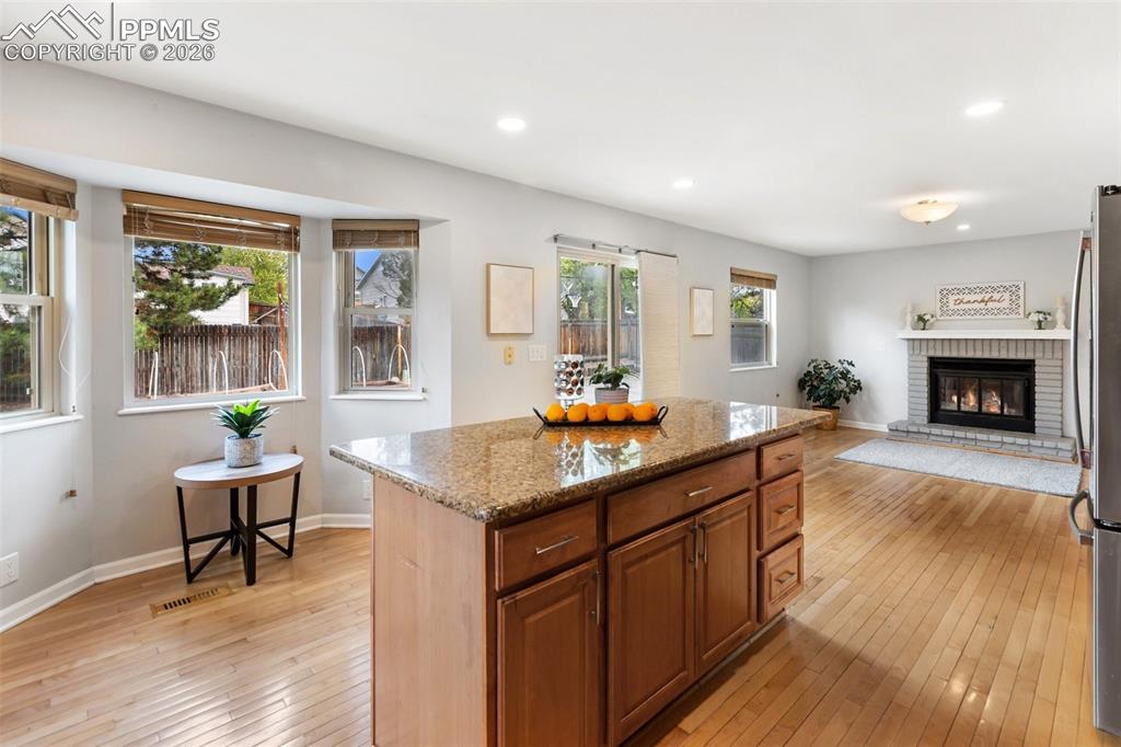 Image 13 of 43: Large kitchen looks into family room 