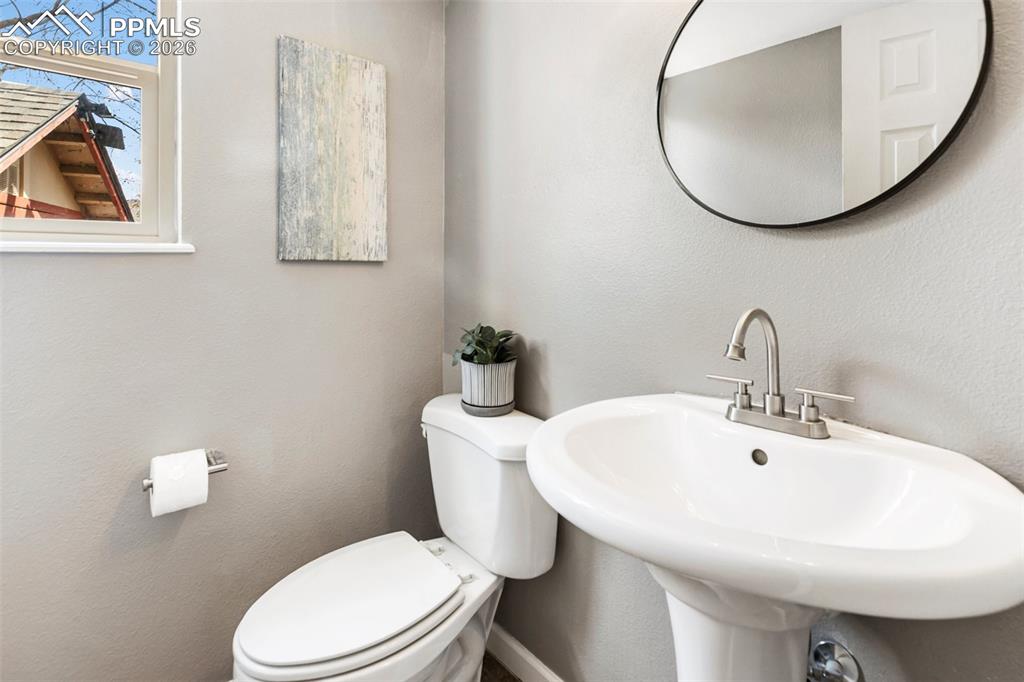 Image 22 of 43: Main level half bath