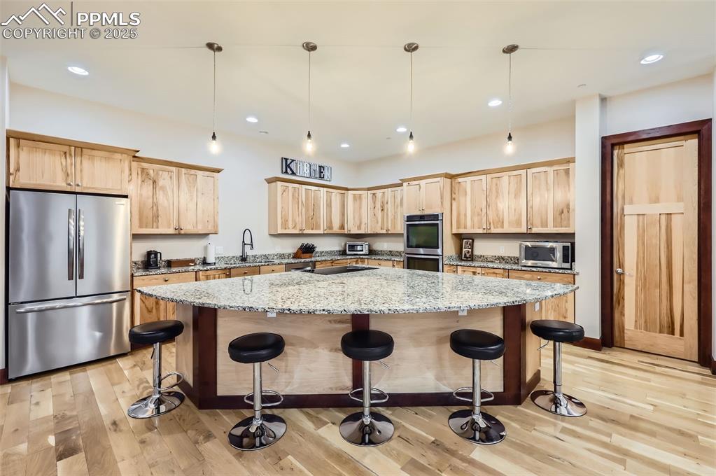 Image 3 of 41: Plenty of seating at the huge kitchen island