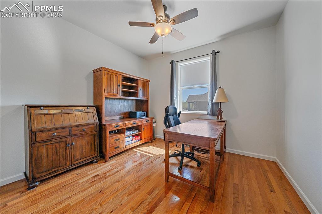 Image 19 of 35: Office area featuring ceiling fan, light wood-style floors, and baseboards