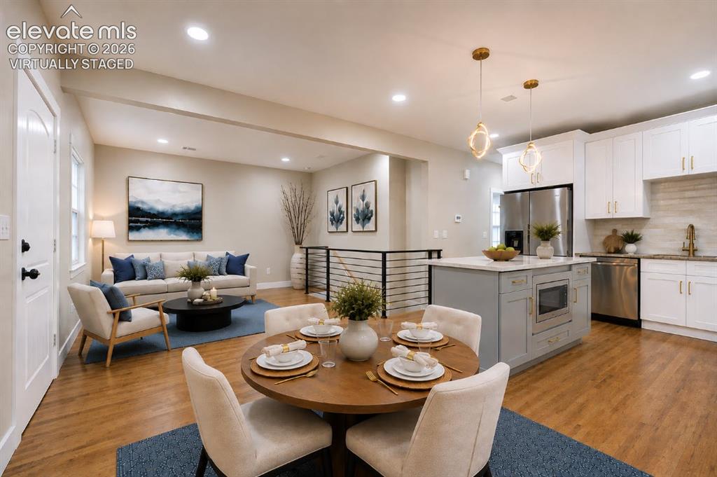 Image 12 of 49: Same view, but virtually staged. The living room furniture layout shows the