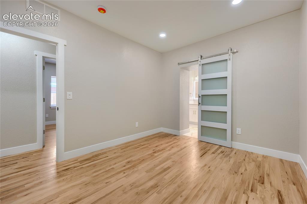 Image 19 of 49: Another view of your roomy primary suite.